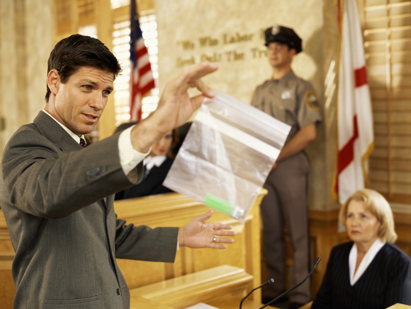 Male lawyer displaying evidence to jury — Winning Trial Advocacy ...