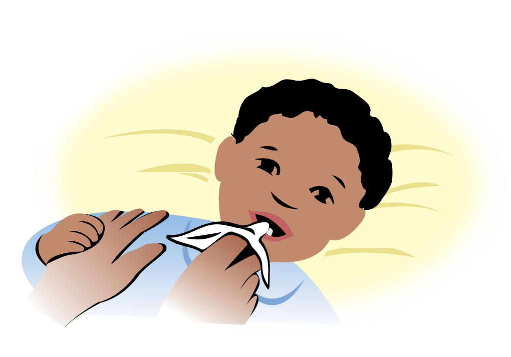 Parent Cleaning Baby's Teeth With Soft Cloth