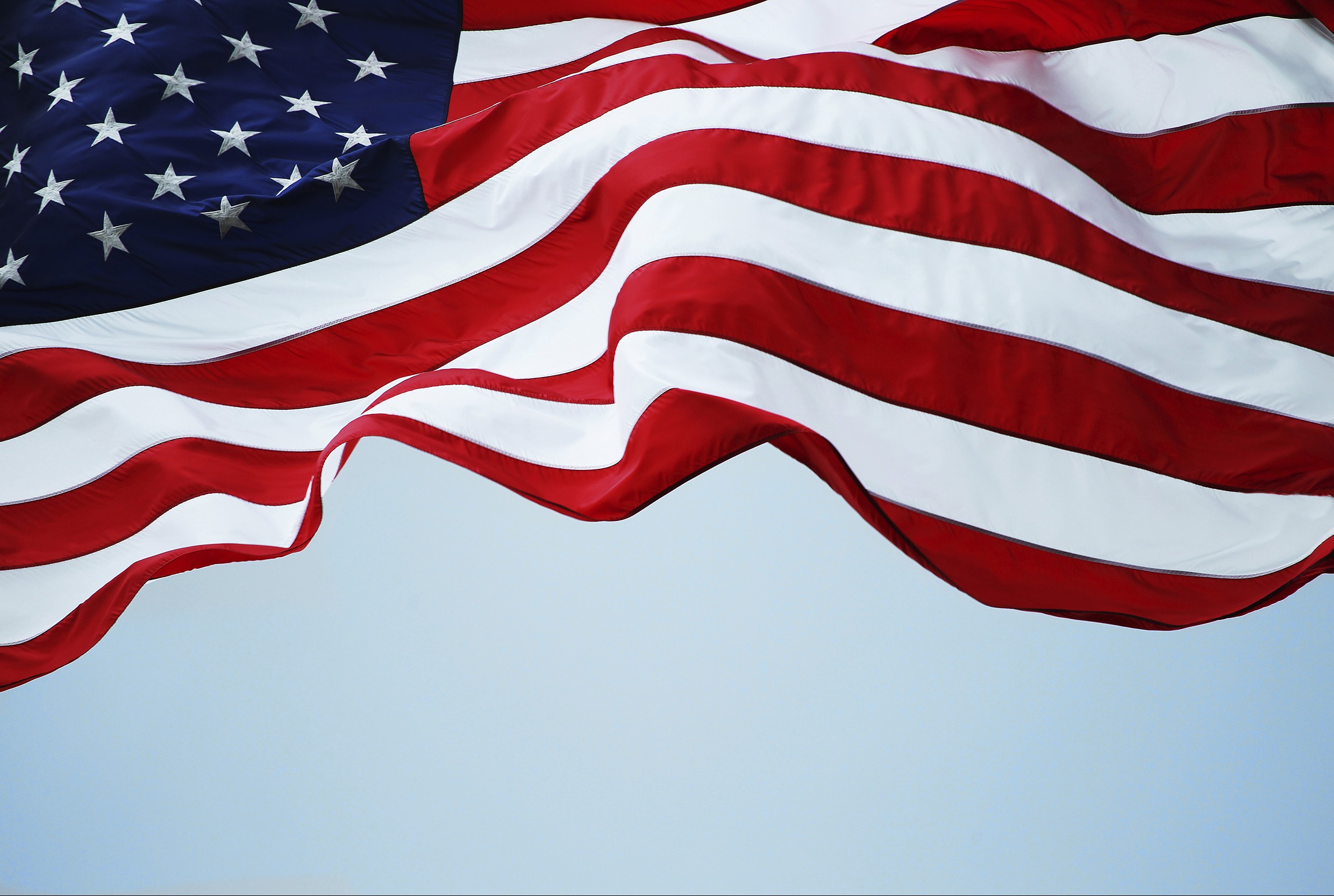 American Flag waving sky | Global Trade Review (GTR)
