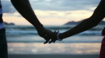 Couple Holding Hands At Sunset Silhouetted Stock Footage Video ...