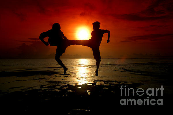 Silhouette Of Two People Fighting by Antoni Halim