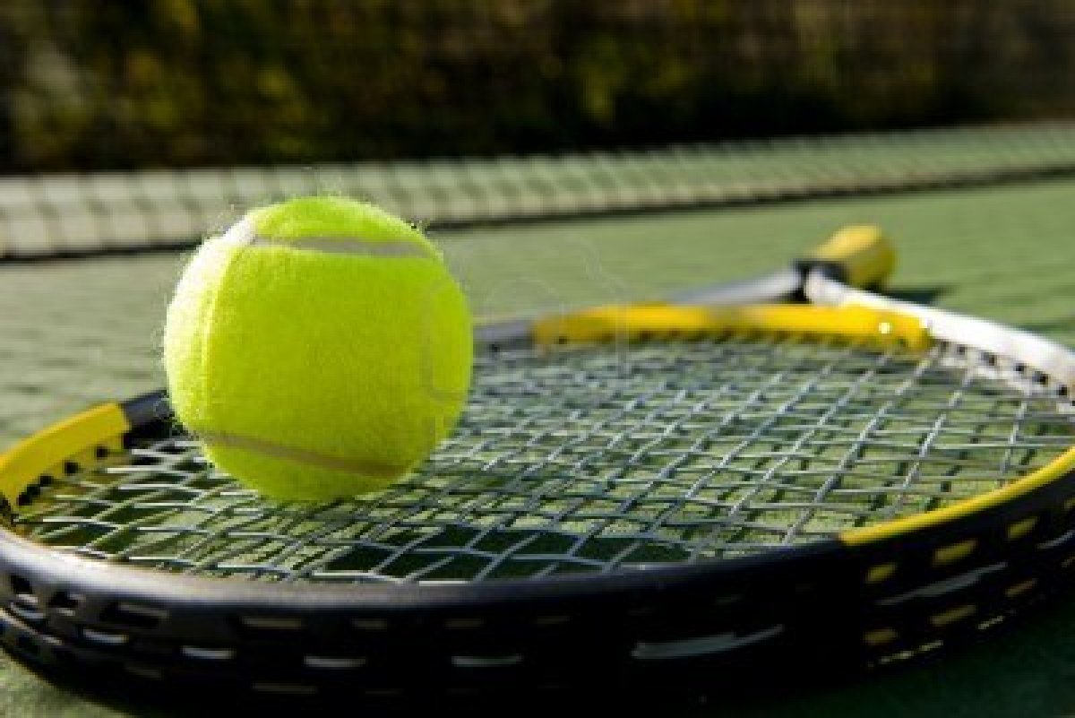 5193324-a-tennis-racket-and-new-tennis-ball-on-a-freshly-painted ...