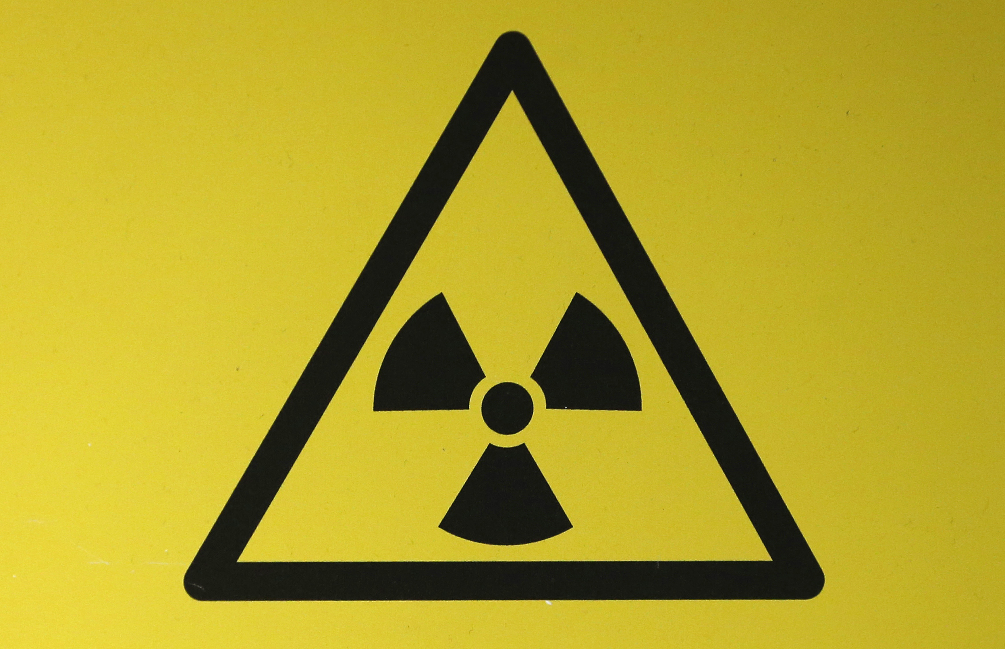 A RADIOACTIVE MATERIAL HAZARD SYMBOL, CALLED A TREFOIL, IS SEEN ...