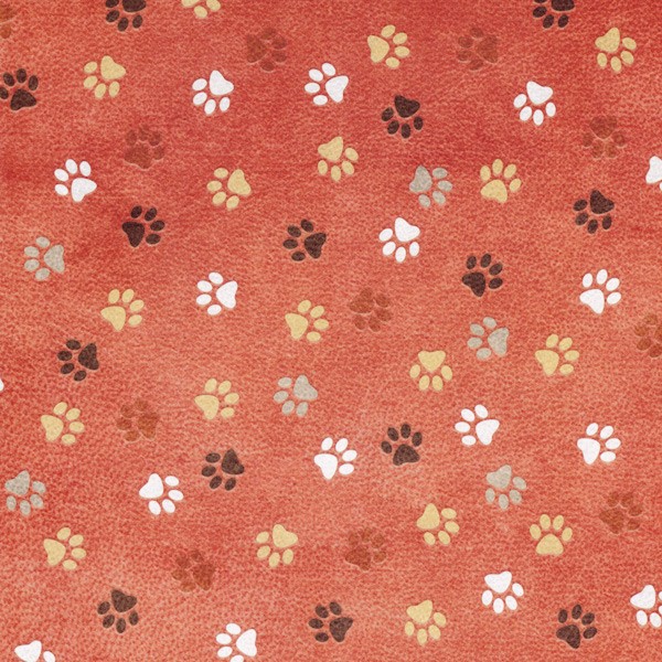 Papel de scrapbooking rojo con huellas de perro.
