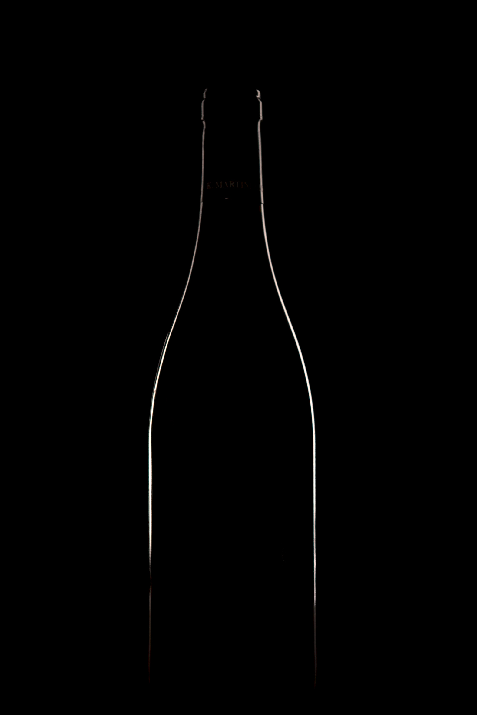 Silhouette of a bottle with a glass (lo-key) | This Is Graphic Design