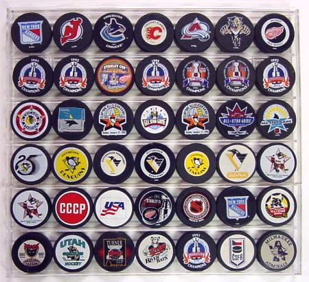 Our hockey puck displays and plaques will display your NHL pucks ...