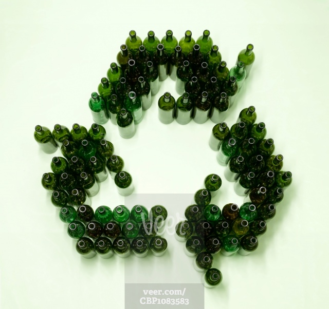 Recycling symbol made of green bottles Stock Photo - Veer.com