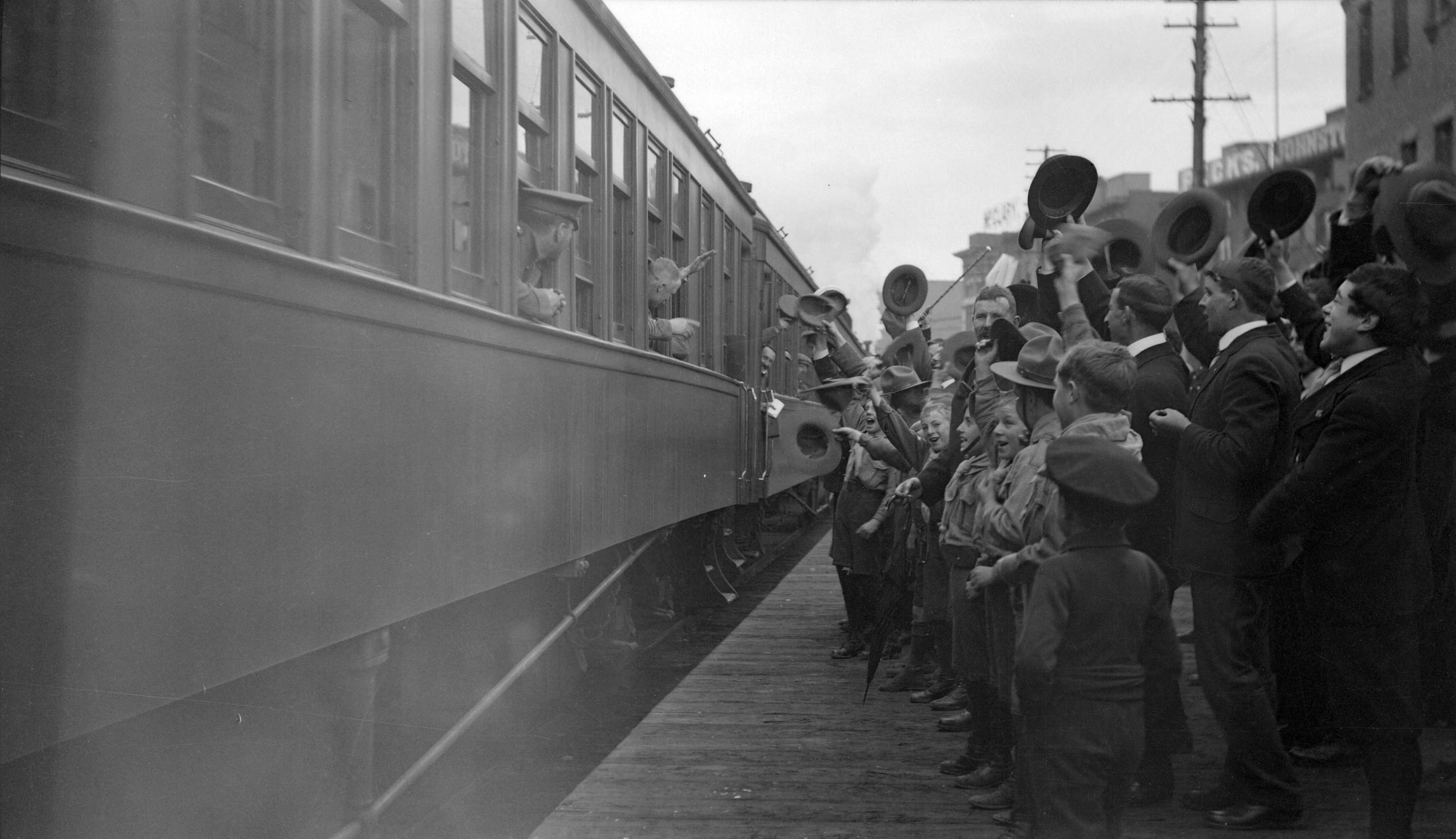 Crowds waving goodbye to troops in train] - City of Vancouver Archives